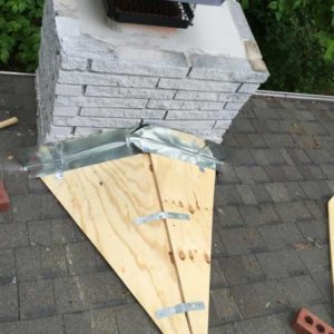 Repointing, crown resurface, chimney chase build, cap install